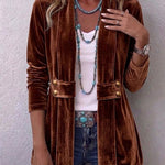 Velvet open-front long-sleeve jacket, dark brown with gold snap buttons and flap pockets.