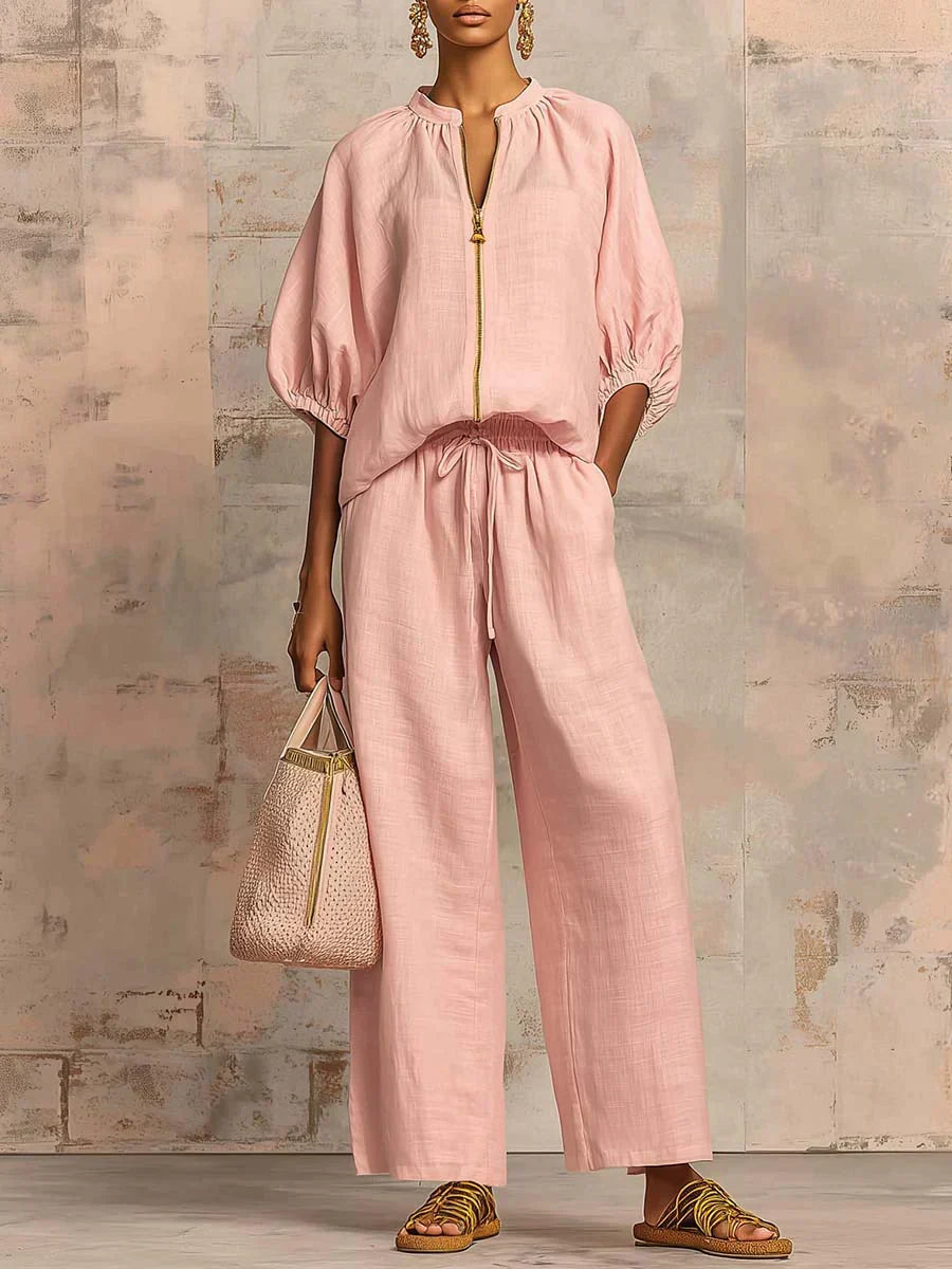 Light pink two-piece blouse and wide-leg pants set with front button placket and tie waist