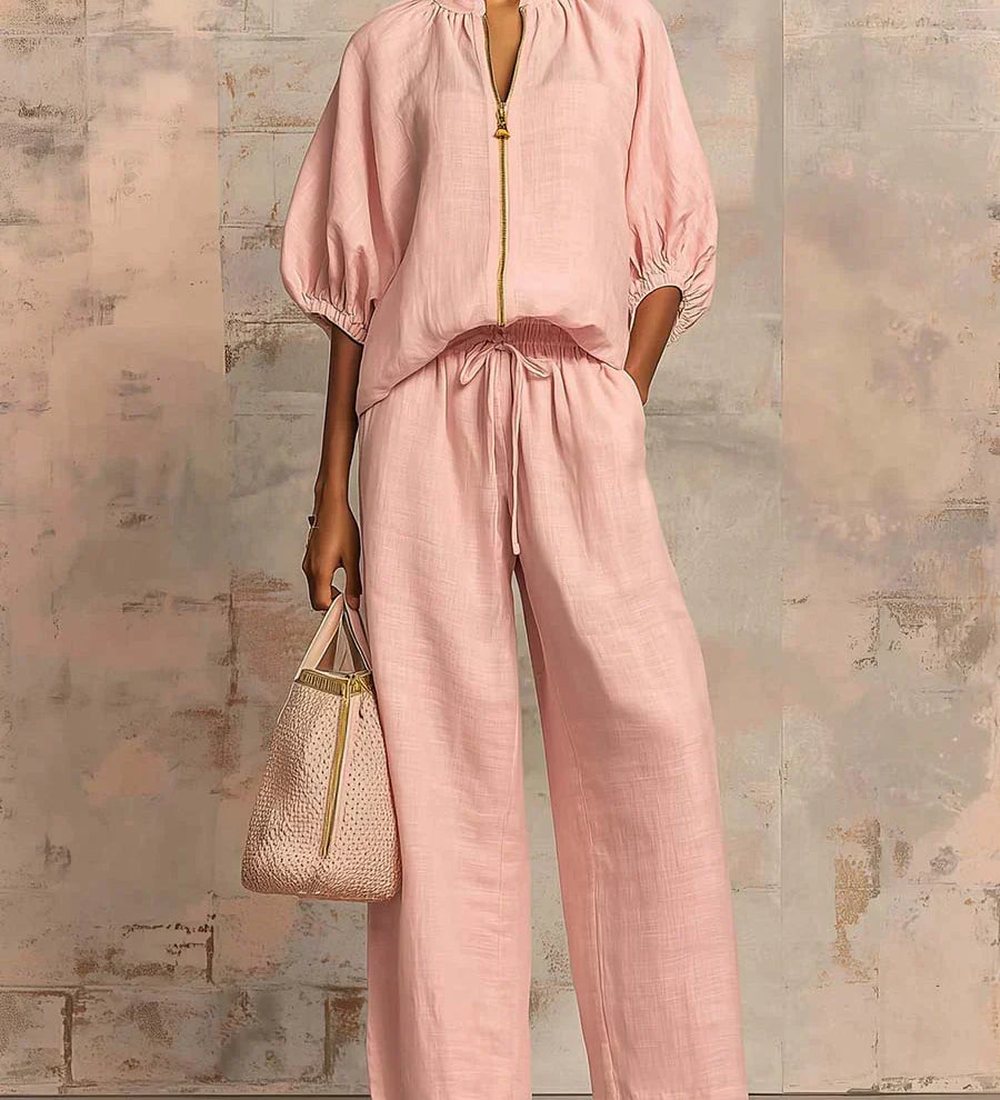 Light pink two-piece blouse and wide-leg pants set with front button placket and tie waist