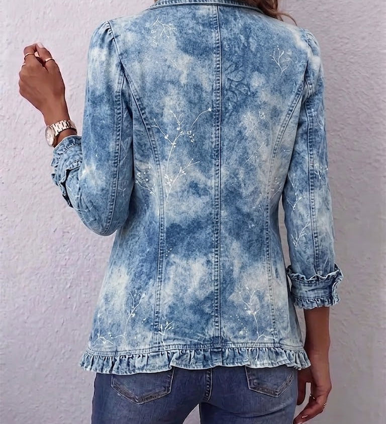 Blue distressed denim jacket back view with button placket and cuffed ruffle hem