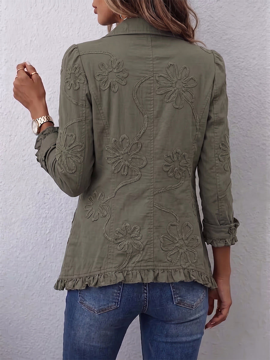 Olive utility jacket back with embroidered floral motifs and button-front design