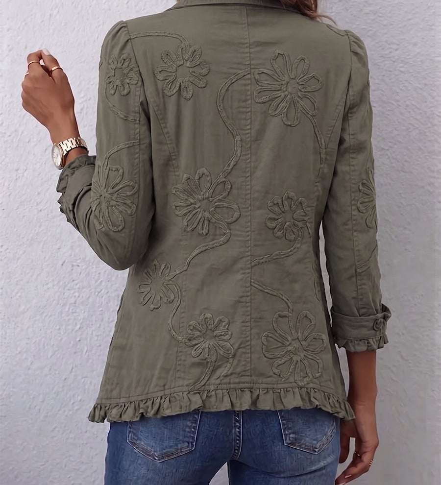 Olive utility jacket back with embroidered floral motifs and button-front design