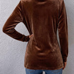 Velvet open-back long-sleeve jacket, dark brown with seam detailing and smooth finish.