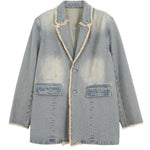 Light-wash denim blazer front view with button closure, frayed trim, chest patch pockets