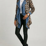 Leopard-print denim jacket with sleeved leopard panels and blue open front