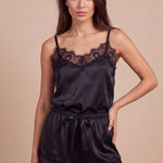 Women's dark satin camisole and lace-trim shorts set with adjustable straps.