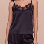 Women's dark satin camisole with lace neckline and matching lace-trim shorts.