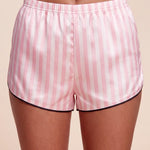 Pink-and-white striped boxer shorts with elastic waistband and black-trimmed hem