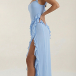 Light blue elegant dress with thin straps, ruffled side detail, and high slit