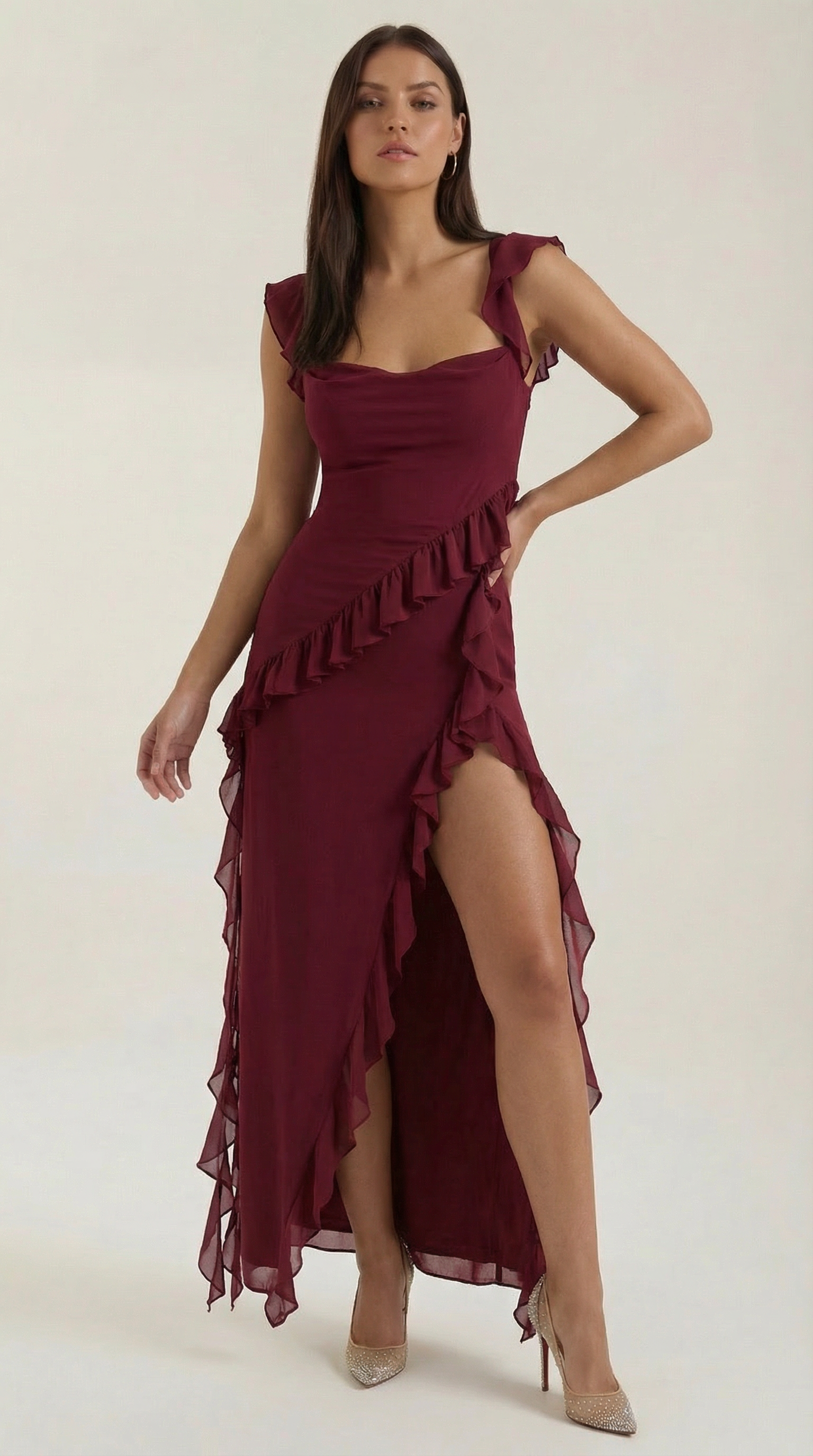 Burgundy elegant dress with thin straps, layered ruffles, and high slit skirt