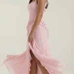 Pink ruffled sleeveless maxi dress with thigh-high slit and tiered skirt