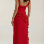 Red elegant dress with thin straps, ruffled waist, and layered asymmetrical skirt