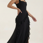 Black sleeveless ruffled maxi dress with thigh-high slit and layered hem