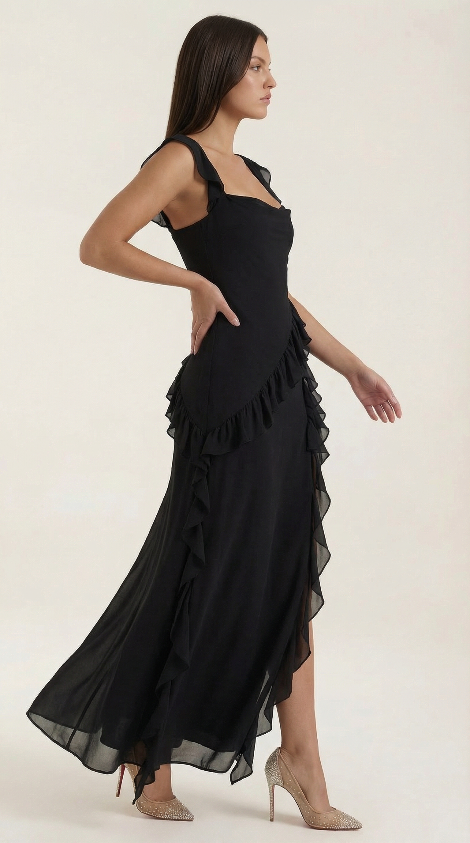 Black sleeveless ruffled maxi dress with thigh-high slit and layered hem