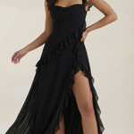 Black elegant dress with thin straps, layered ruffles, and asymmetrical high slit