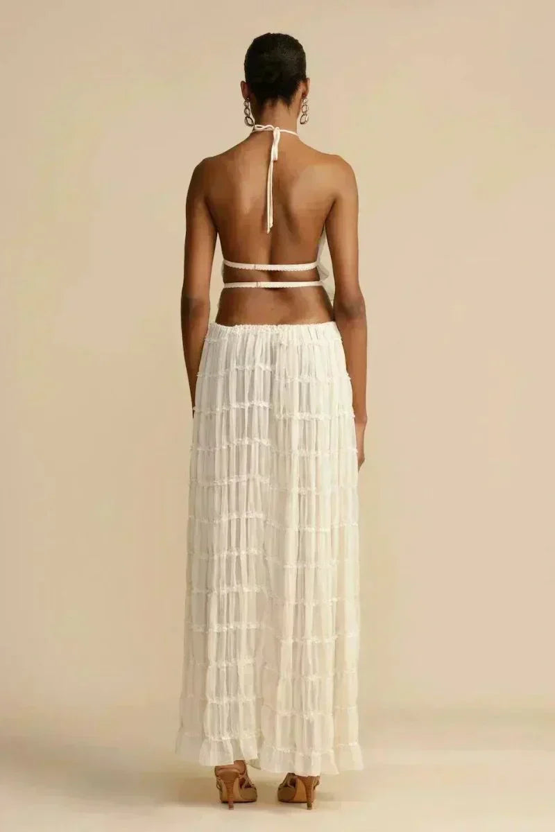 White pleated backless halter crop top with tie-back strap, back view