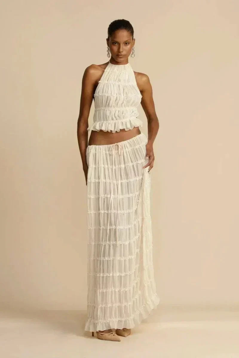 White pleated halter crop top with ruffled tiers, front view