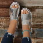 Orthopedic silver open-toe platform sandals with angled straps and beaded ankle band