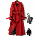 Red classic trench coat with belted waist, button front, and decorative buckles