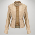 Beige leather-look moto jacket with zip front, stand collar, and asymmetrical pockets