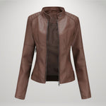 Brown leather-look moto jacket with zip front, stand collar, and side zip accents
