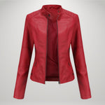 Red leather-look moto jacket with zip front, stand collar, and side pocket zips