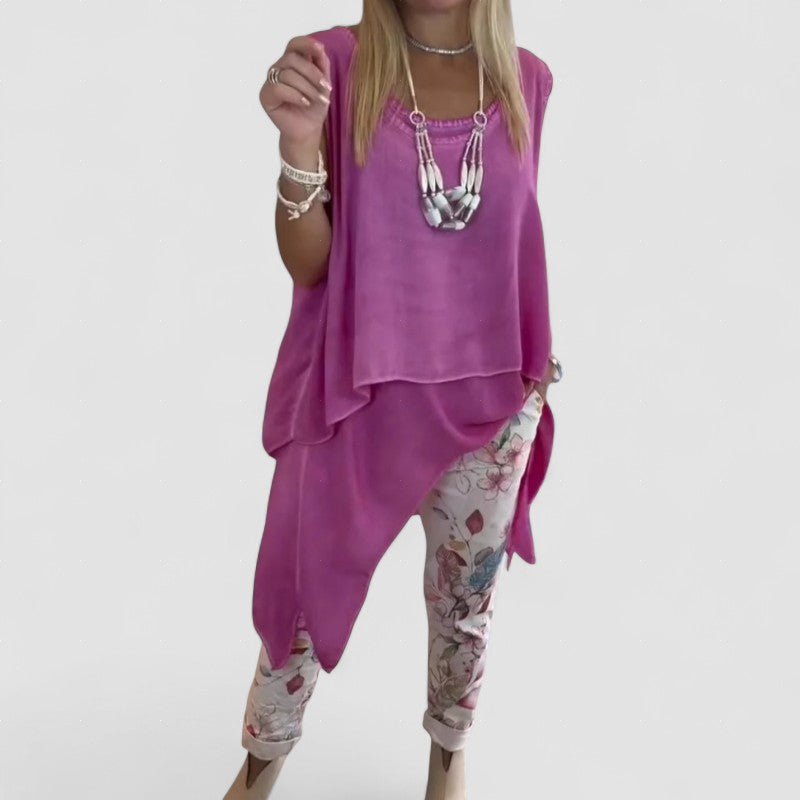 Women's two-piece set with sleeveless magenta top and floral printed pants