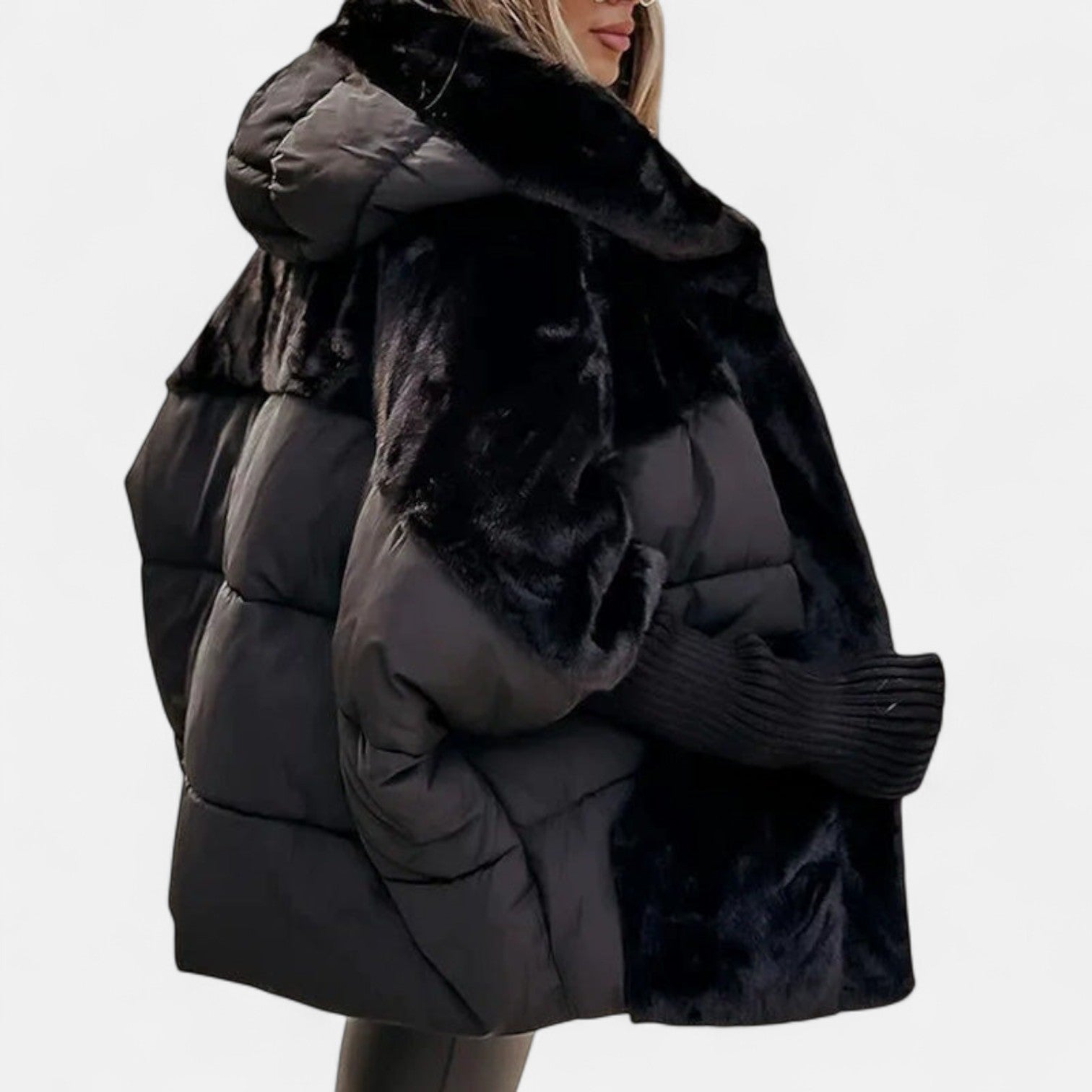 Quilted hooded jacket in dark black with plush faux-fur trim and patchwork front