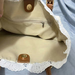 Irina vintage lace shoulder bag interior: beige lining with snap button and zipper pocket