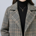 Plaid coat lapels with double-breasted button line and contrast stitching detail