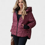 Ema maroon quilted jacket with hood, full-length zipper and black cuffs