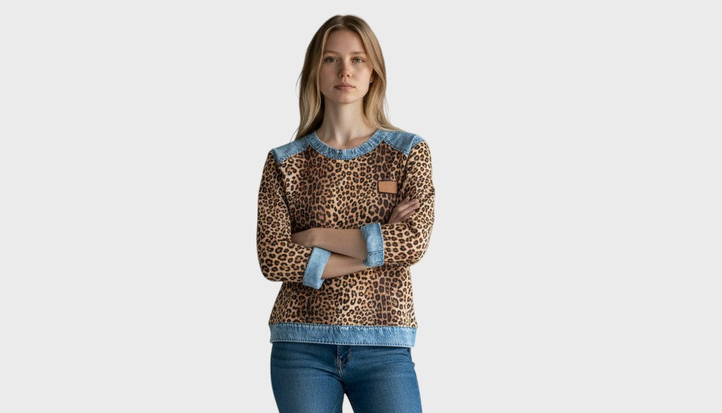 Leopard print long-sleeve top with light denim collar, cuffs, hem and tan chest patch