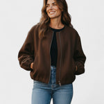 Brown cropped bomber jacket with front zipper, elastic cuffs, and side pockets