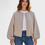 Light beige cropped zip-front bomber jacket with ribbed cuffs and side pockets