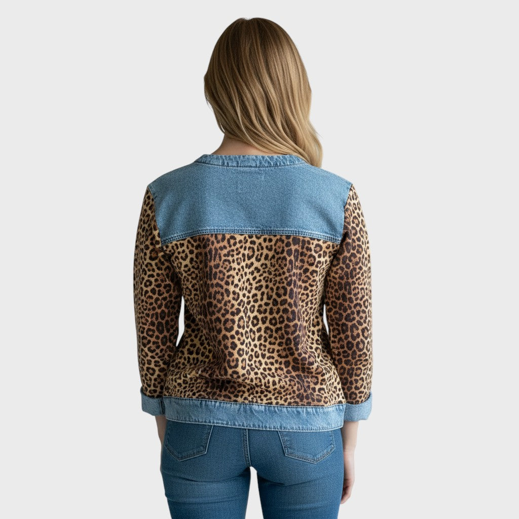 Back view leopard print long-sleeve top with light denim yoke, cuffs, and hem