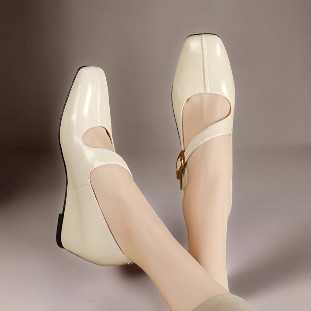 Cream Mary Jane leather flats, heel and side view with gold buckle detail