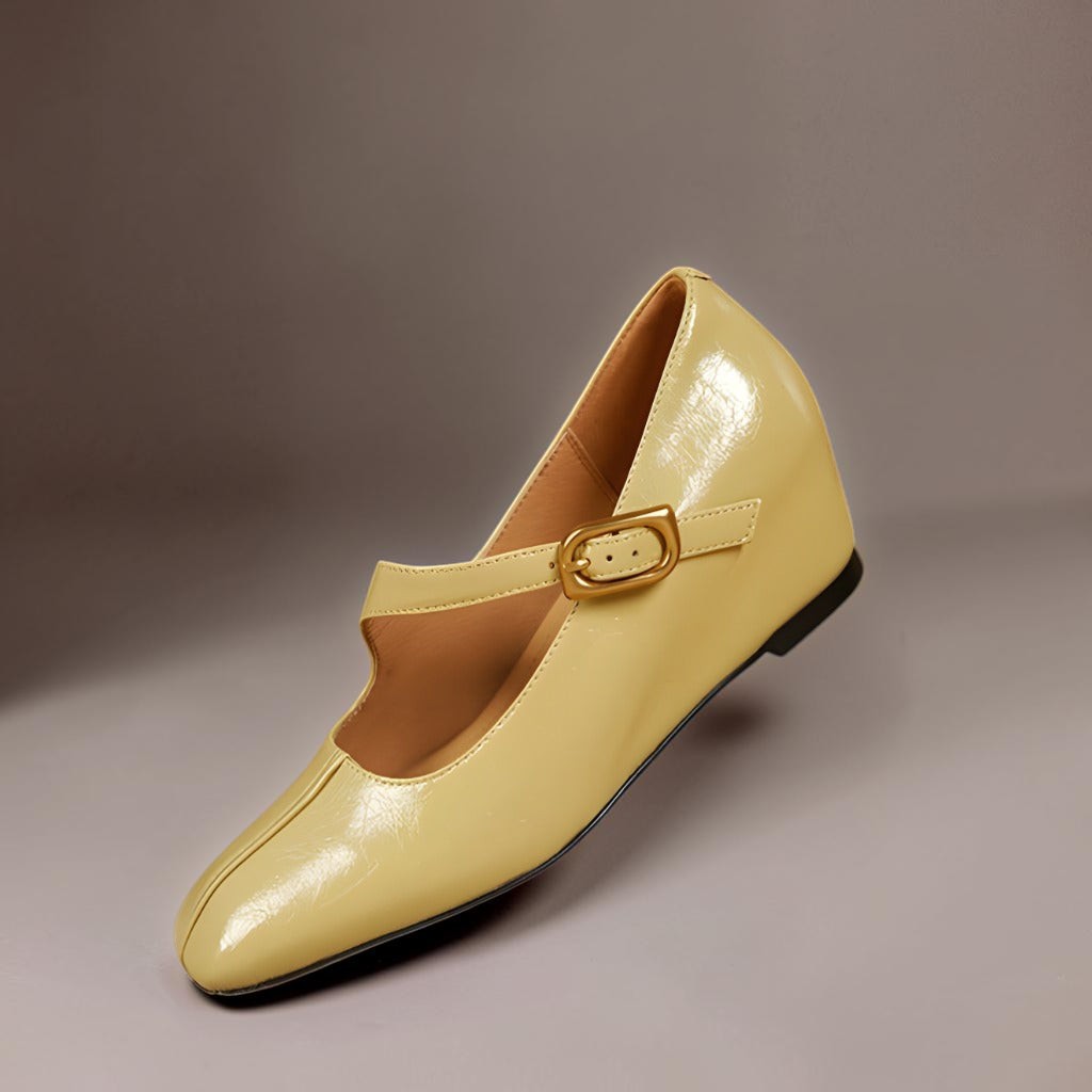 Yellow patent leather Mary Jane flat shoes with buckled strap, front view