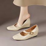 Cream Mary Jane leather flats with low wedge heel and gold buckle strap
