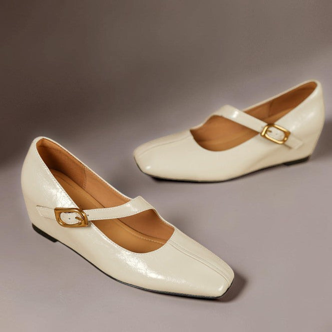 Cream Mary Jane leather flats, pair shot with gold buckle strap