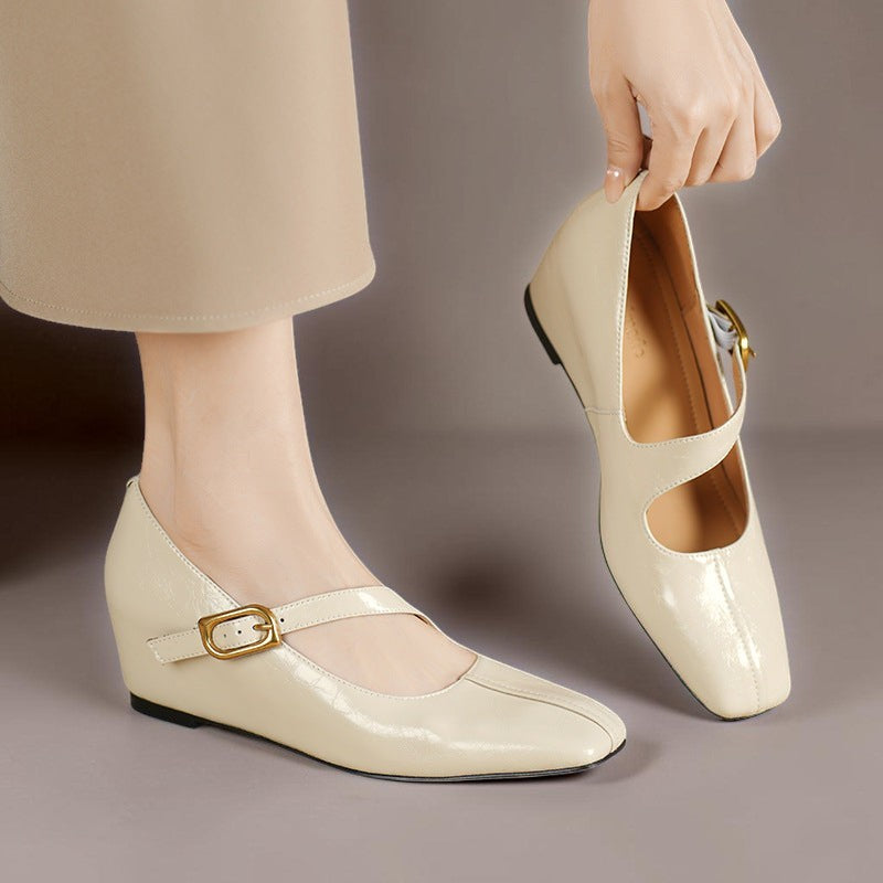 Cream Mary Jane leather flats with open instep and gold buckle strap