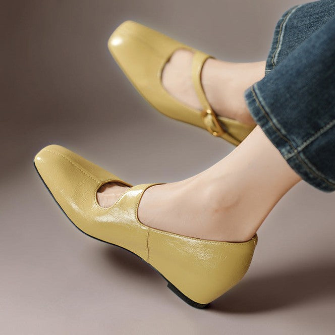 Yellow leather Mary Jane block heel shoes with buckle strap, side view