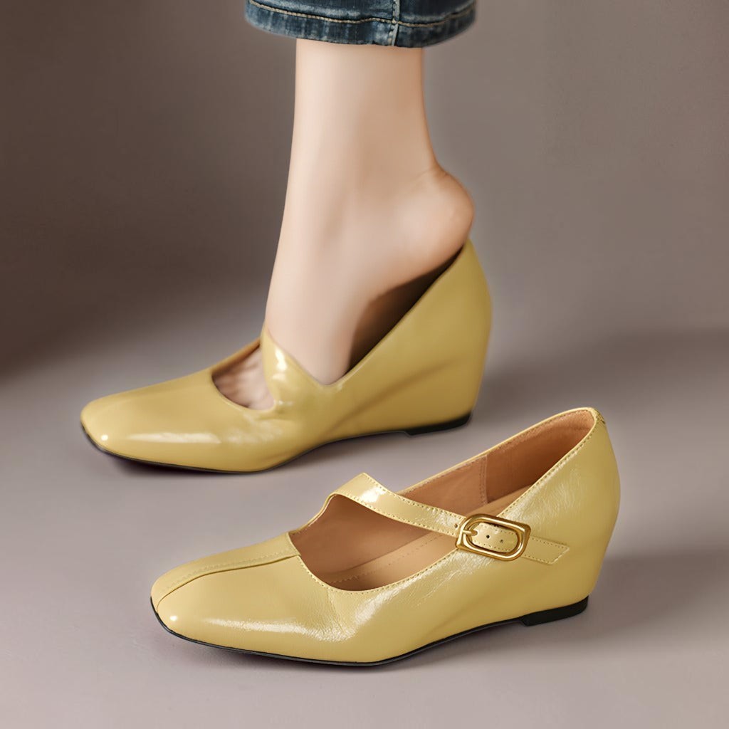 Yellow Mary Jane leather flats with low wedge heel and gold buckle strap