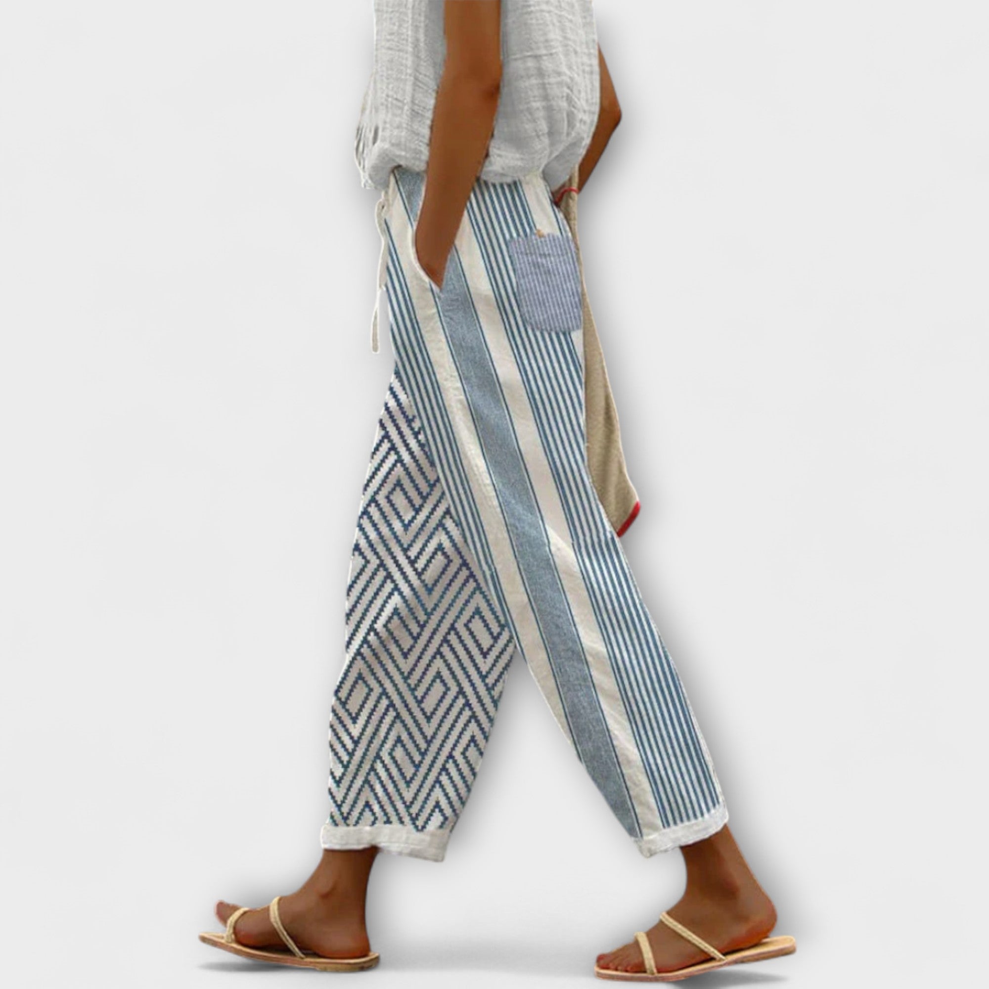 Wide-leg striped and chevron printed pants in light blue tones, drawstring waist
