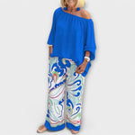 Blue off-shoulder peasant top and wide-leg printed pants two-piece set