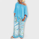 Light blue off-shoulder peasant top and wide-leg printed pants two-piece set