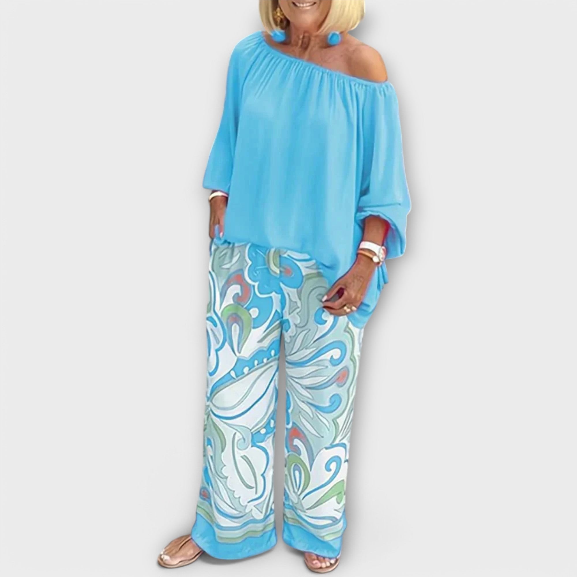 Light blue off-shoulder peasant top and wide-leg printed pants two-piece set