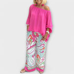 Pink off-shoulder peasant top and wide-leg printed pants two-piece set