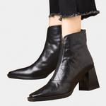 Black mid-heel ankle boot with side zipper and smooth leather-look upper