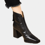 Black ankle boot with medium block heel and side zipper, sleek leather-look finish