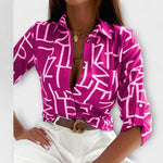 Classic collar button-front blouse with magenta abstract print and long sleeves